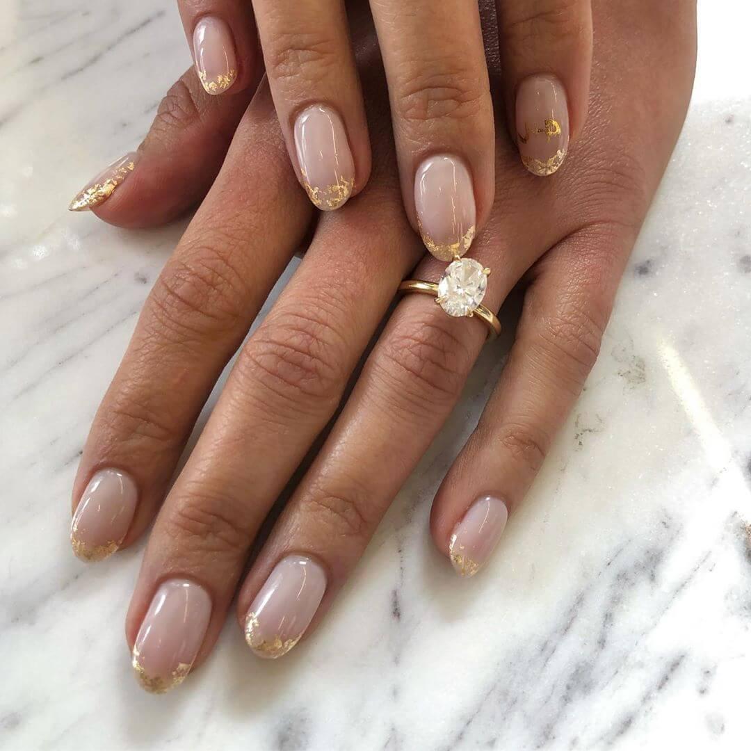 ongles français dorés pour la mariée